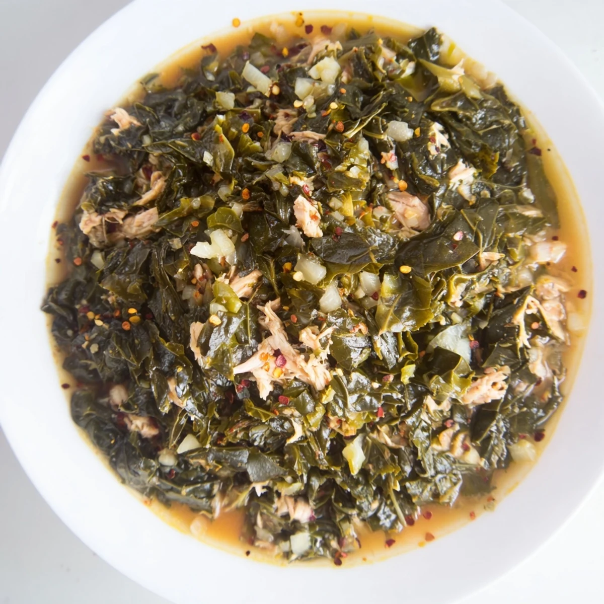 Savory Southern style collard greens and smoked turkey, seasoned with flavorful spices, ready to serve.