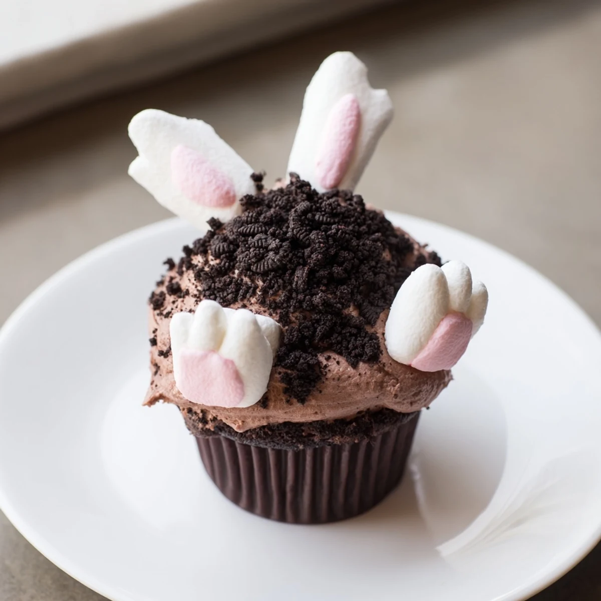 Adorable Bunny Burrow Cupcake Tray displays moist chocolate cupcakes with delicious chocolate buttercream frosting.