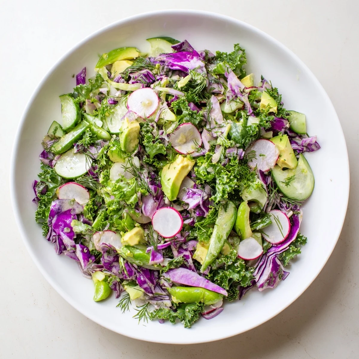 Close-up of a refreshing Green Goddess Detox Cabbage Salad, vibrant with colorful, crisp vegetables.