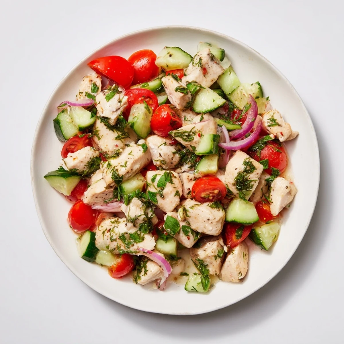 This clean shaker salad features tender chicken, bursting with flavors and a tangy dressing.