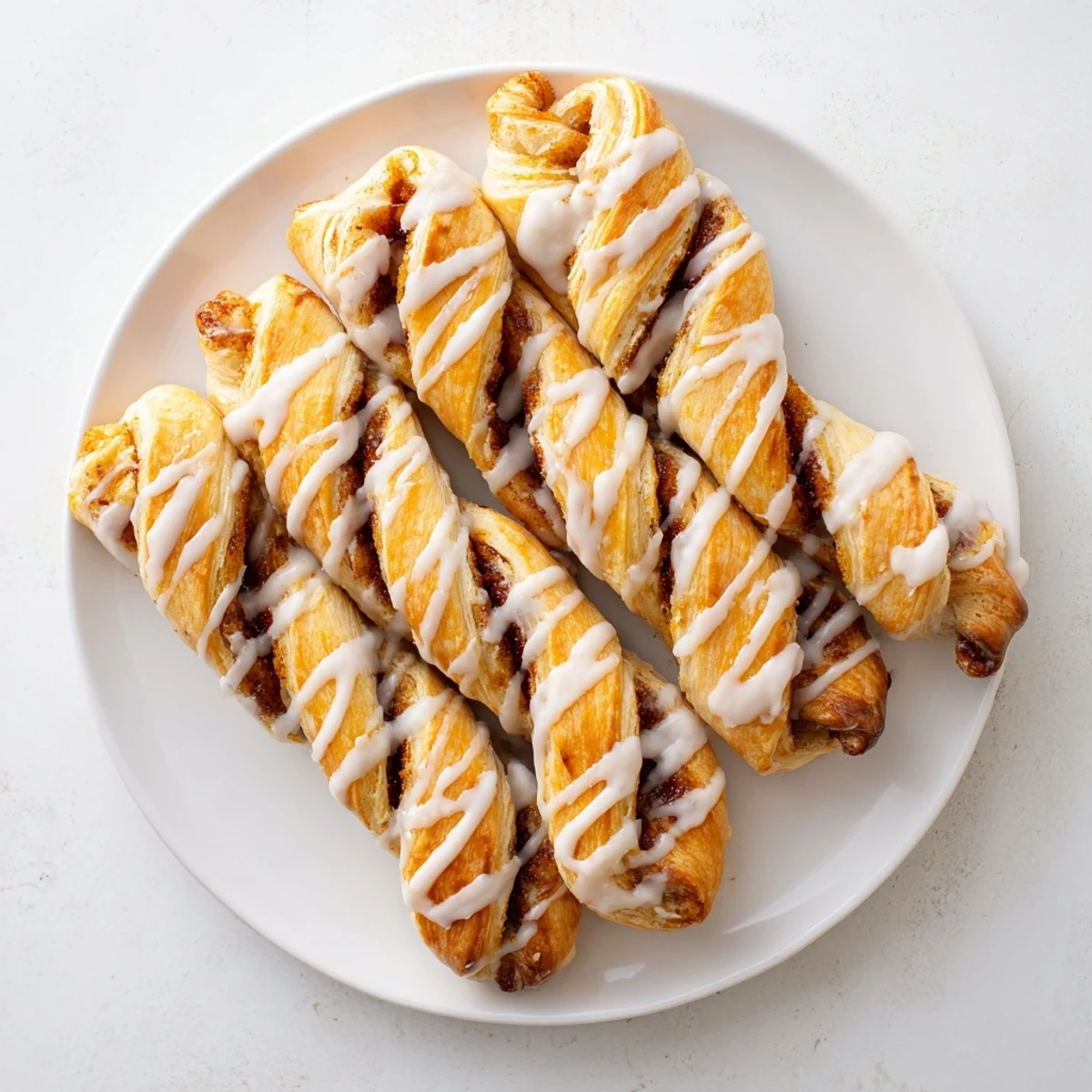 Air-Fryer Cinnamon Roll Twists: Flaky golden pastries with a cinnamon-sugar swirl, perfect for a quick breakfast.