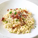 Quick and easy Instant Pot Carbonara Ramen: a comforting bowl topped with fresh parsley.