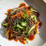 These Chilled Noodle Lunch Cups showcase glistening noodles and colorful veggies, a quick, fresh meal idea.