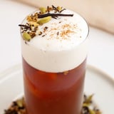 Sweet, creamy homemade iced chai layered over ice with a sprinkle of cinnamon for visual appeal.