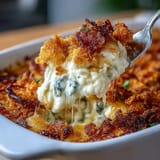 Spicy and cheesy jalapeño cheddar funeral potatoes casserole, bubbling with melted cheddar and crunchy cornflake crust straight from the oven.
