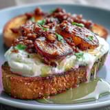 Golden honey peach burrata toast with creamy cheese, fresh basil, and a drizzle of honey for spring brunch.