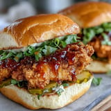 Juicy fried chicken sandwich, generously drizzled with spicy sweet hot honey.