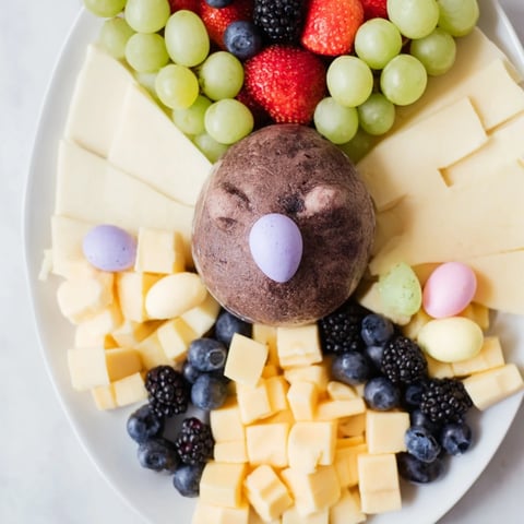 Bunny Ears Easter Board bursting with vibrant fruits, cheeses, and adorable treats for Easter.