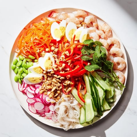 Colorful Asian Fusion Noodle Bowl Board with vibrant vegetables and dipping sauces, ready to enjoy.