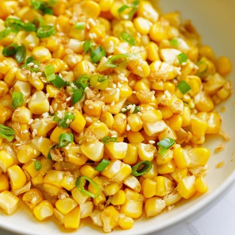 Golden Japanese Butter Corn glistening in a skillet, ready for a delicious, savory side.