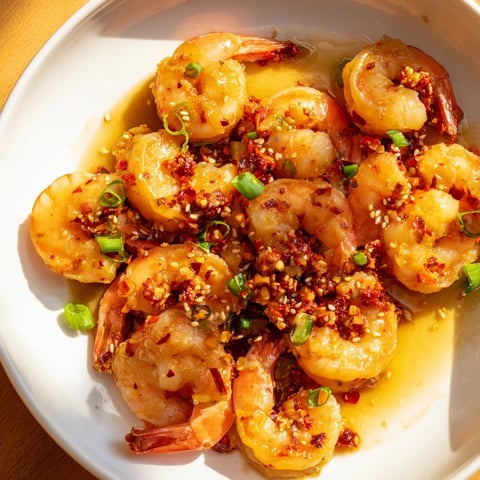 Golden garlic butter shrimp, with glistening sauce and scallion garnish, ready to serve this Korean-inspired recipe.