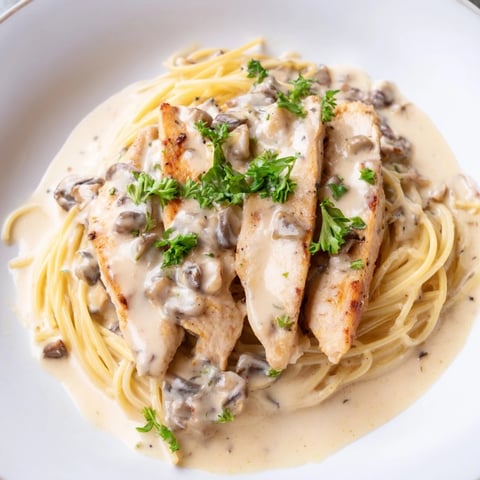 Tender chicken and earthy mushrooms nestled in a creamy sauce over al dente spaghettini.  