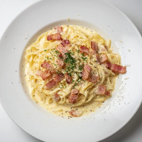 Creamy Instant Pot Carbonara Ramen, featuring perfectly cooked noodles and crispy bacon.