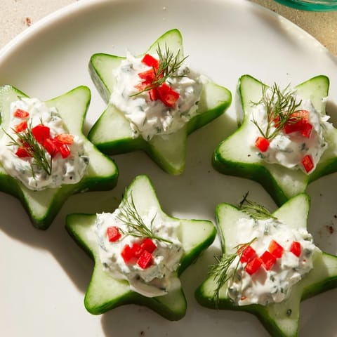 Freshly made Cucumber and Dill Christmas Stars, perfectly shaped and ready to enjoy with a holiday gathering.