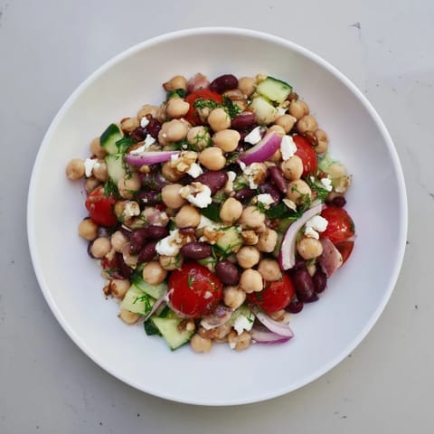 Close-up of a refreshing Dense Bean Salad, featuring hearty beans and the tart cherry vinaigrette.