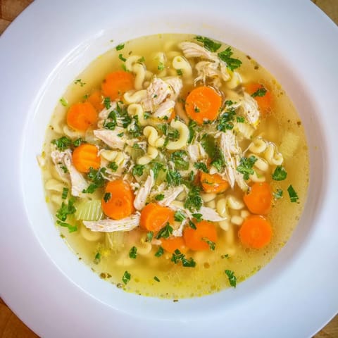 Warm, flavorful Chicken and Ditalini Flu Fighter Soup, perfect for a cozy, comforting meal.