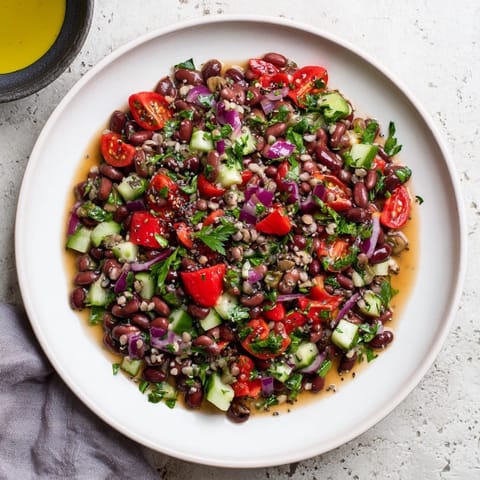 A colorful close-up of the hearty Dense Bean Salad, perfect for a healthy and satisfying lunch.