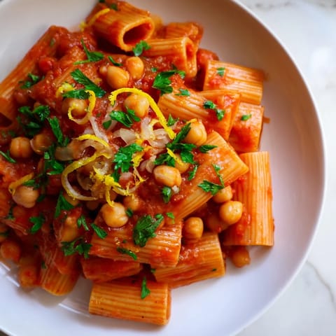 Flavorful Harissa Chickpea Pasta showcasing al dente penne; perfect for a vegetarian dinner.
