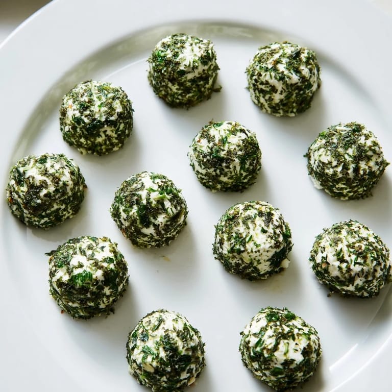 Imagine creamy goat cheese The Mossy Stone "stones," surrounded by edible garnishes in this vibrant spread.