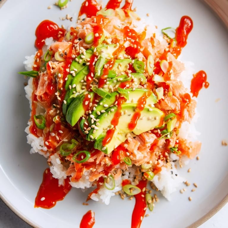 Savory and comforting classic salmon rice bowl, perfect with Japanese mayo, toasted sesame seeds, and seaweed.