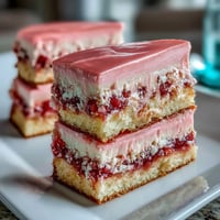 Beautiful Spring Ombre Cake with pastel pink and yellow layers, frosted in silky buttercream for a soft, gradient effect.