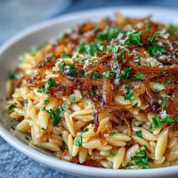 Tender orzo tossed with sweet caramelized onions and fresh parsley.